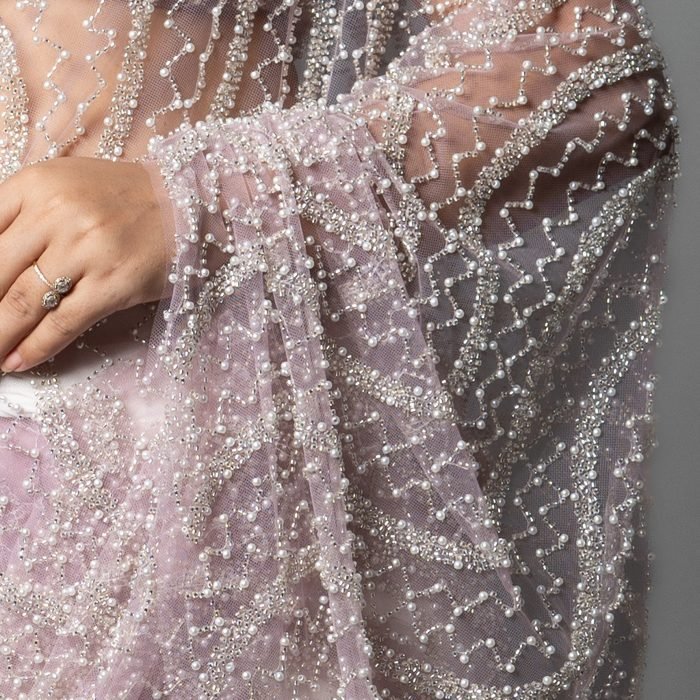 Close-up of sequin and thread fabric detail